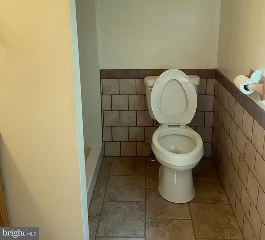 a bathroom with a toilet and a sink