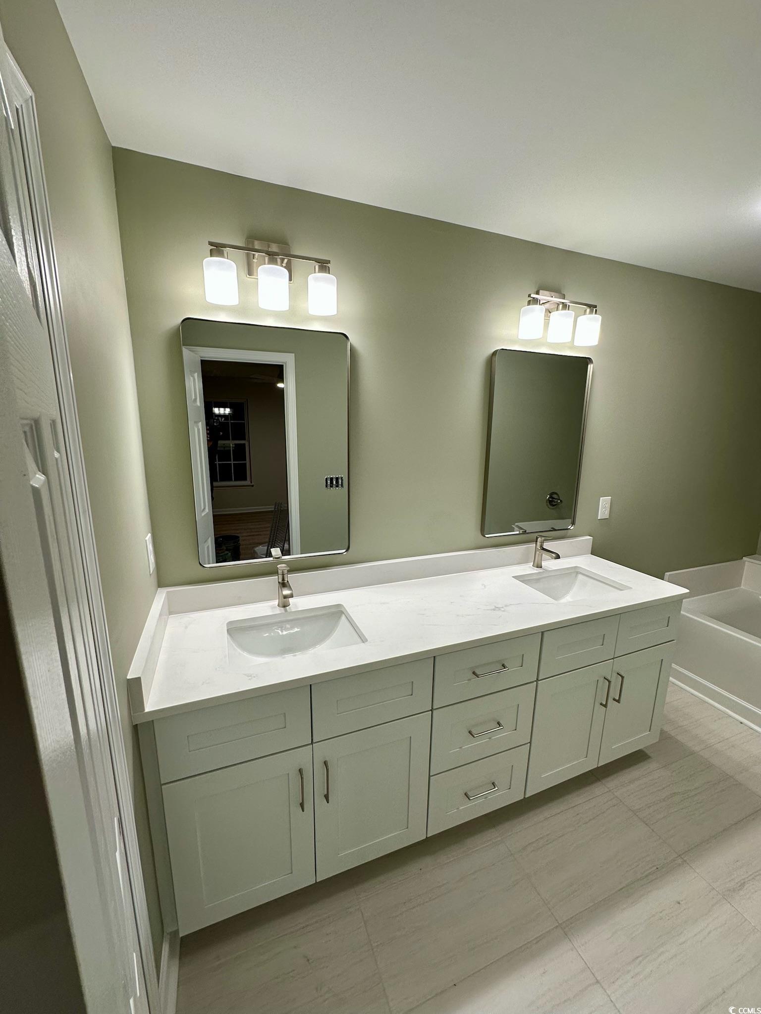 9 Pistachio Loop, Unit D Murrells Inlet, SC 29576 - Photo 12 of 21 Bathroom with double vanity and a bath