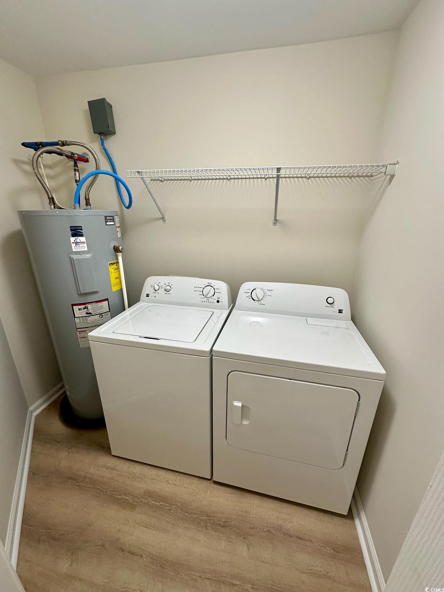 9 Pistachio Loop, Unit D Murrells Inlet, SC 29576 - Photo 18 of 21 Laundry area featuring electric water heater, separate washer and dryer, and light wood finished floors