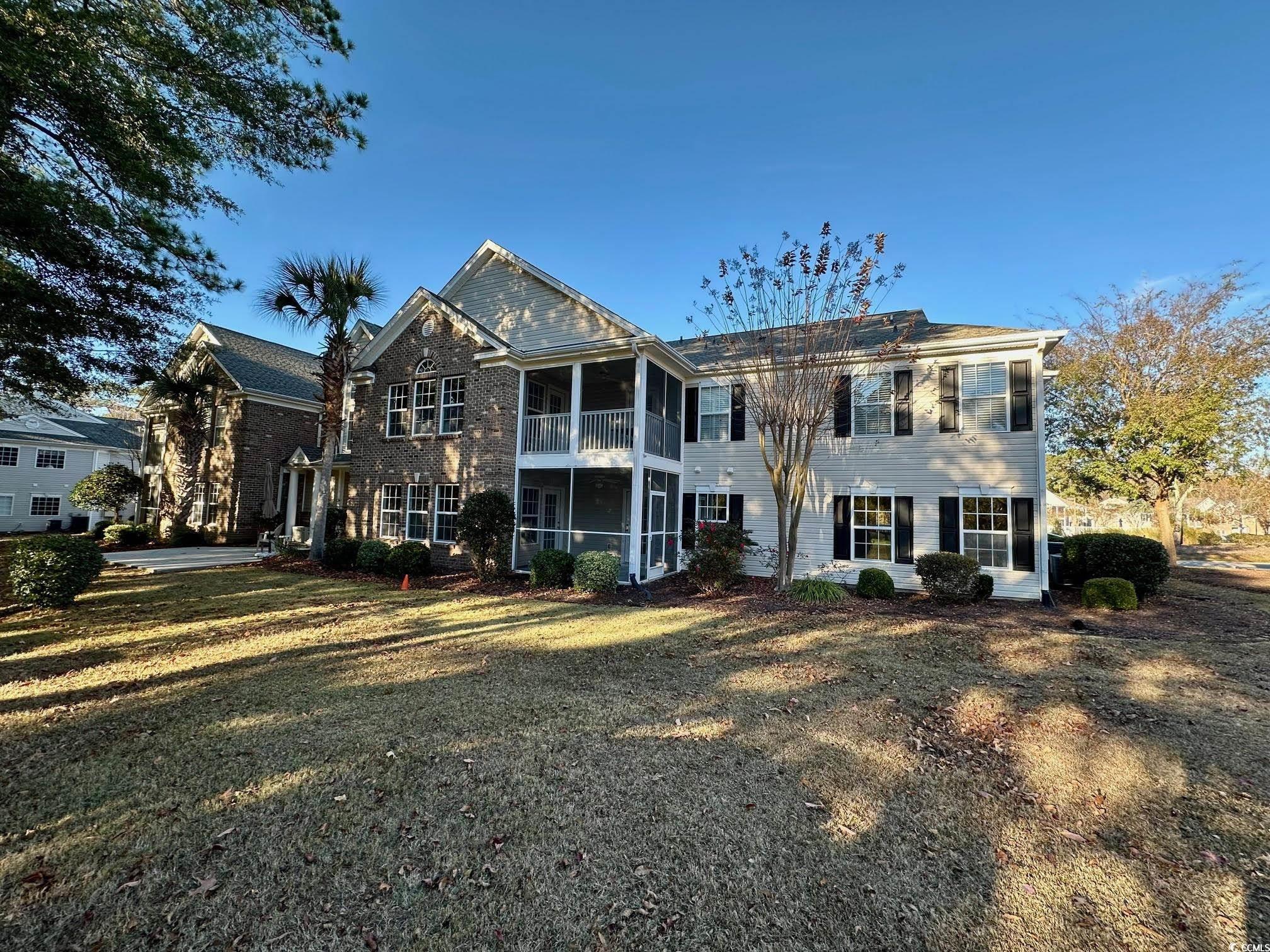 9 Pistachio Loop, Unit D Murrells Inlet, SC 29576 - Photo 21 of 21 Back of property with a balcony and a yard
