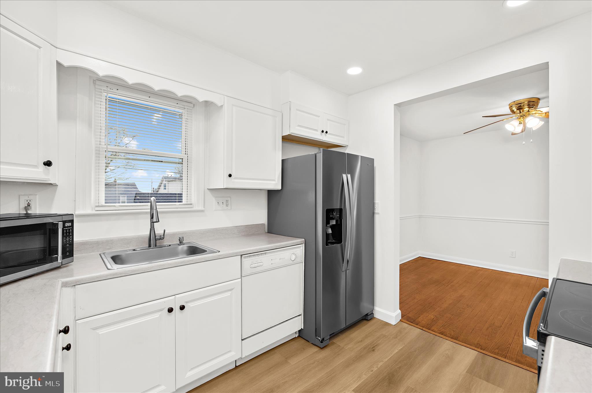 5701 Magie Street Baltimore, MD 21225 - Photo 14 of 49 a kitchen with a refrigerator and a sink