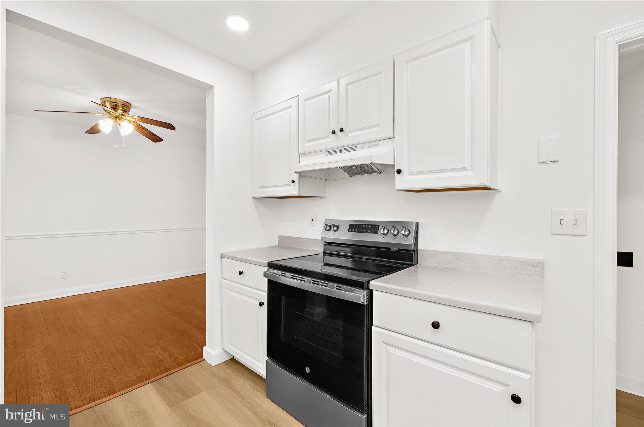 5701 Magie Street Baltimore, MD 21225 - Photo 16 of 49 a kitchen with cabinets and appliances
