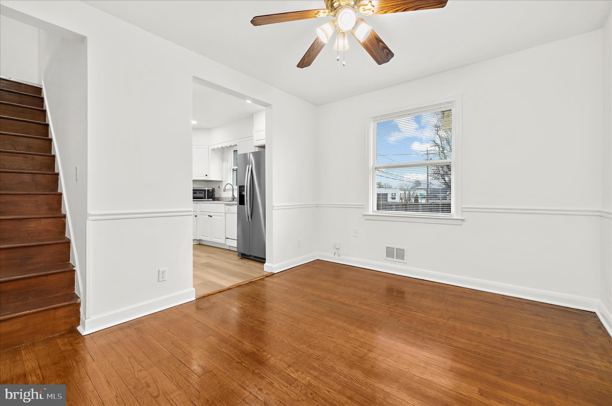 5701 Magie Street Baltimore, MD 21225 - Photo 20 of 49 a view of empty room with wooden floor