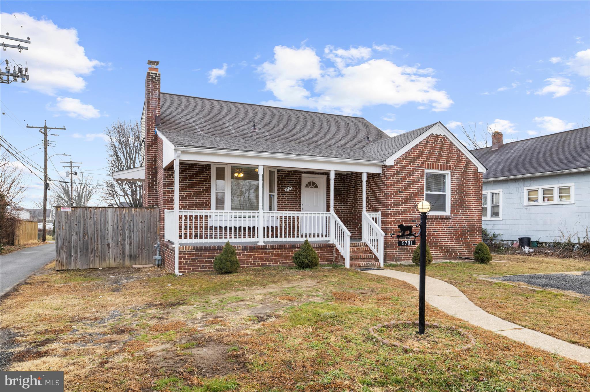 5701 Magie Street Baltimore, MD 21225 - Photo 2 of 49 a front view of a house with a yard