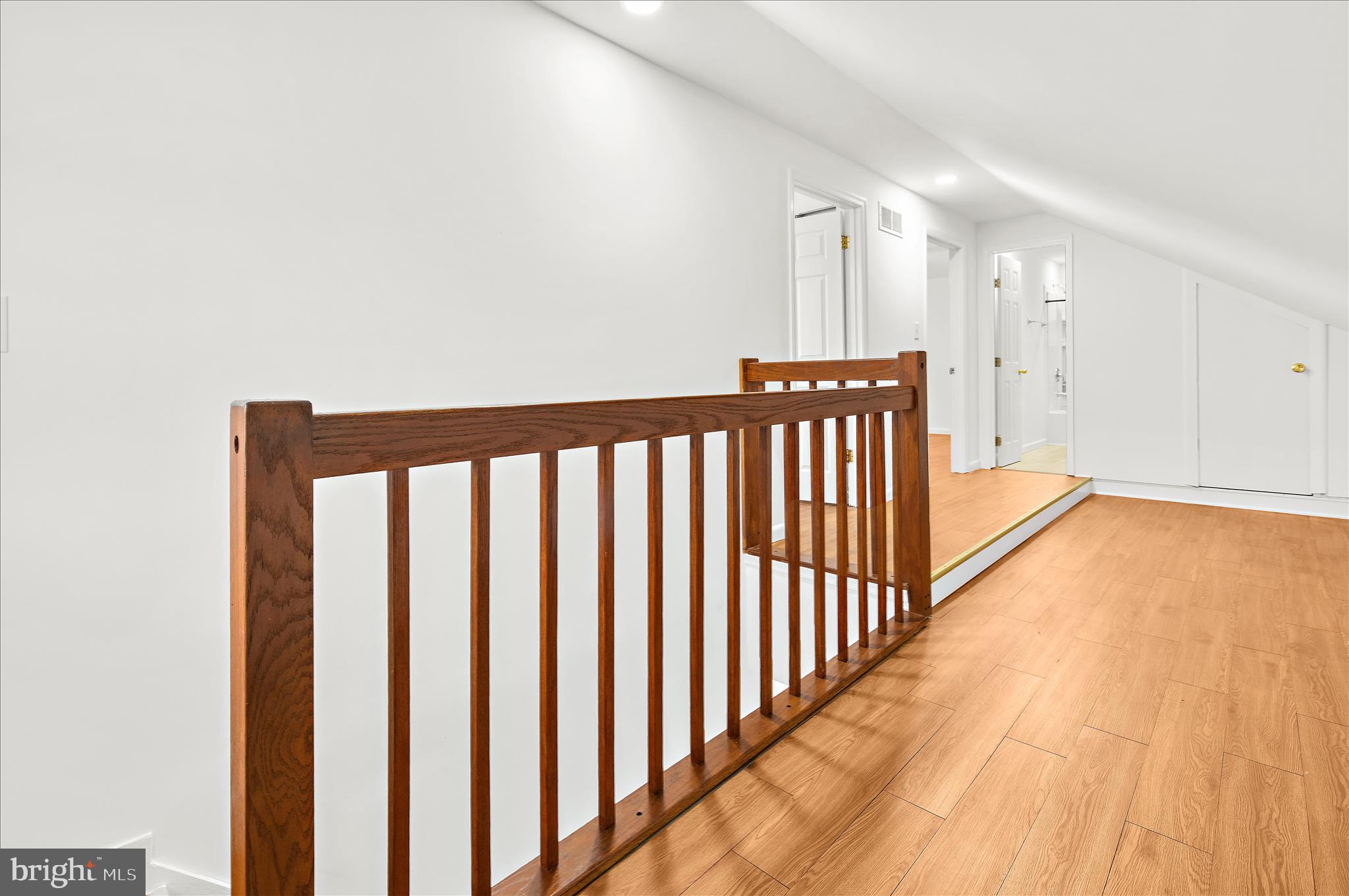5701 Magie Street Baltimore, MD 21225 - Photo 26 of 49 a view of a hallway with wooden floor