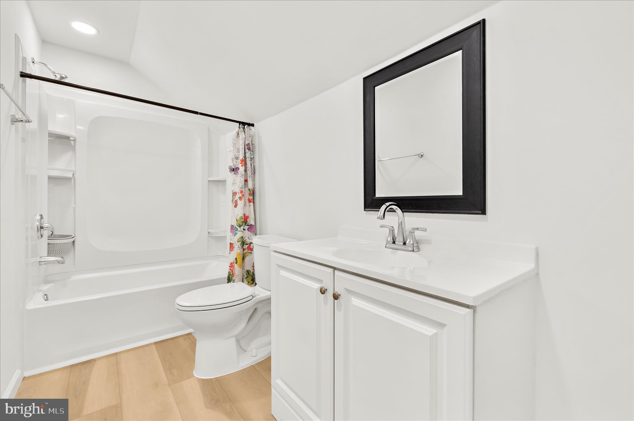 5701 Magie Street Baltimore, MD 21225 - Photo 27 of 49 a bathroom with a sink toilet and shower