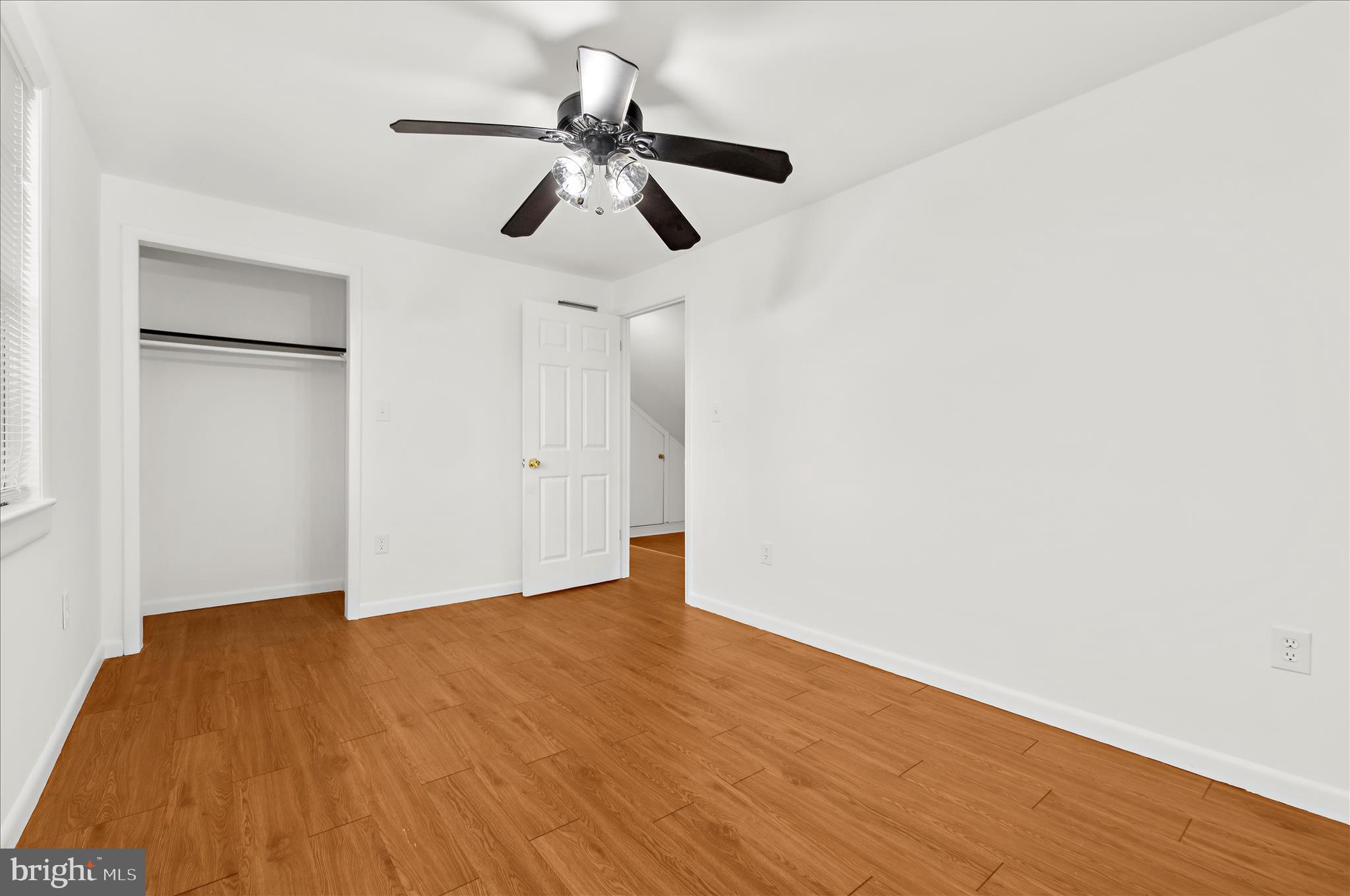 5701 Magie Street Baltimore, MD 21225 - Photo 29 of 49 a view of an empty room with wooden floor