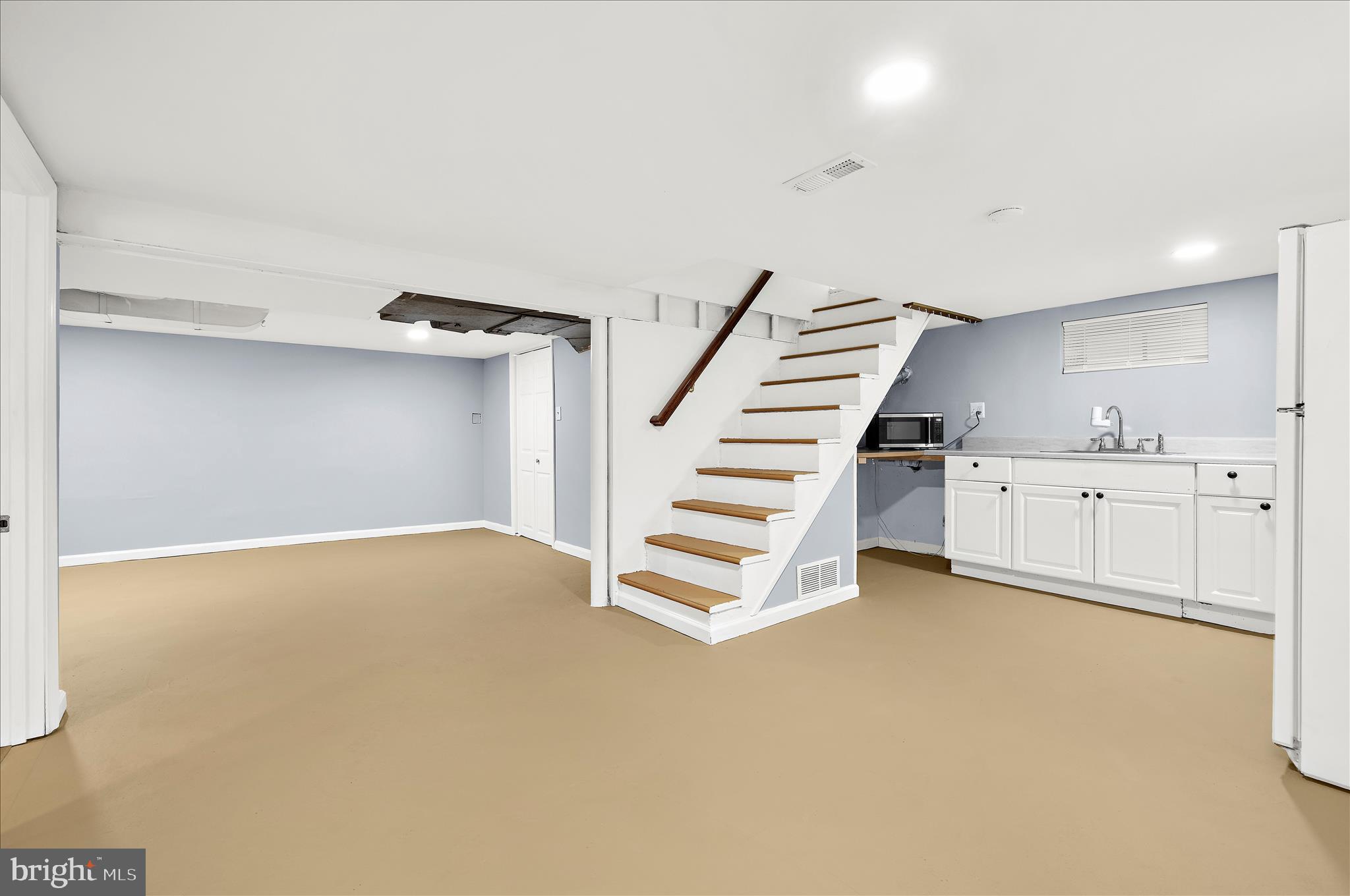 5701 Magie Street Baltimore, MD 21225 - Photo 30 of 49 a view of an empty room with a kitchen