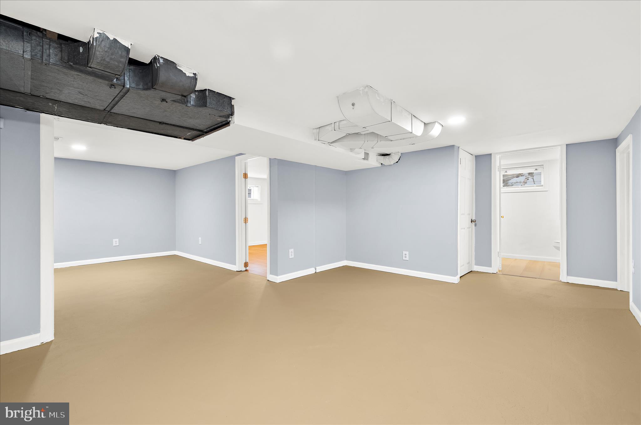 5701 Magie Street Baltimore, MD 21225 - Photo 36 of 49 a view of an empty room and chandelier fan