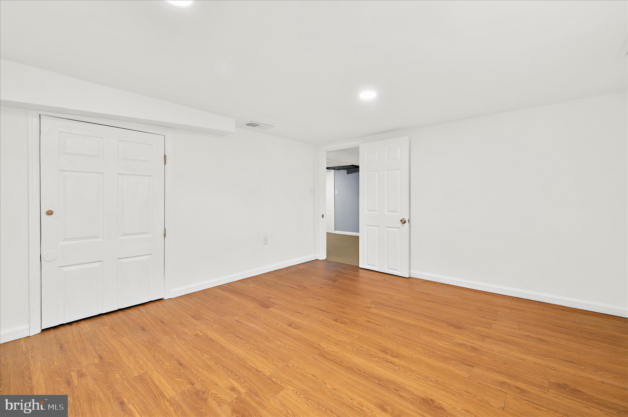 5701 Magie Street Baltimore, MD 21225 - Photo 37 of 49 wooden floor in an empty room