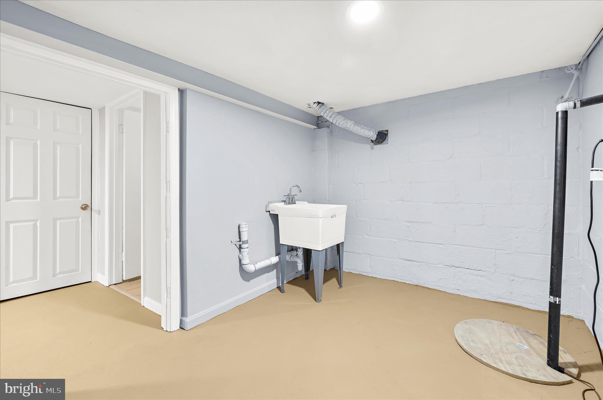 5701 Magie Street Baltimore, MD 21225 - Photo 38 of 49 a view of a livingroom with a table and a chair