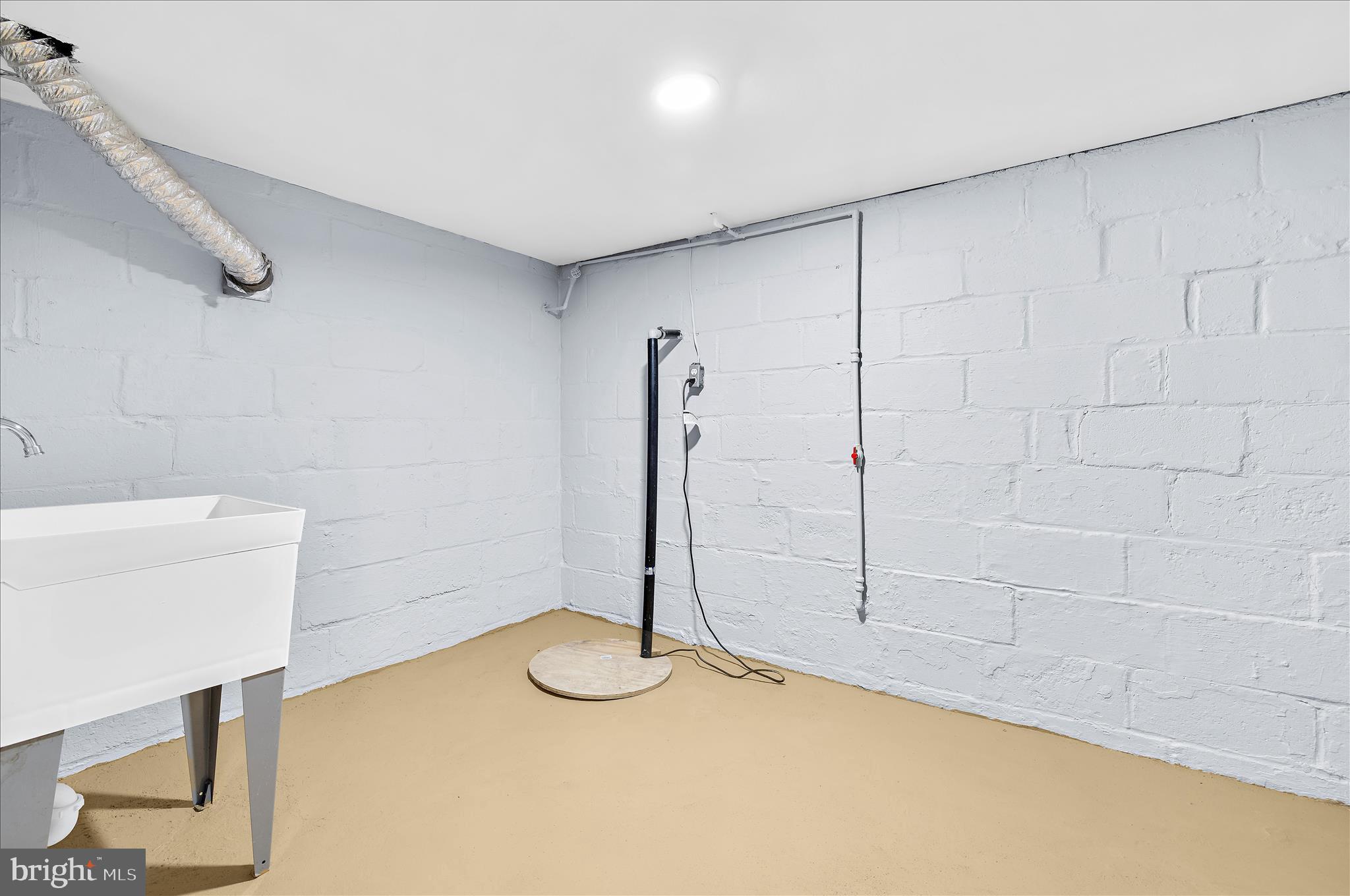 5701 Magie Street Baltimore, MD 21225 - Photo 39 of 49 a view of a room with racks on the wall