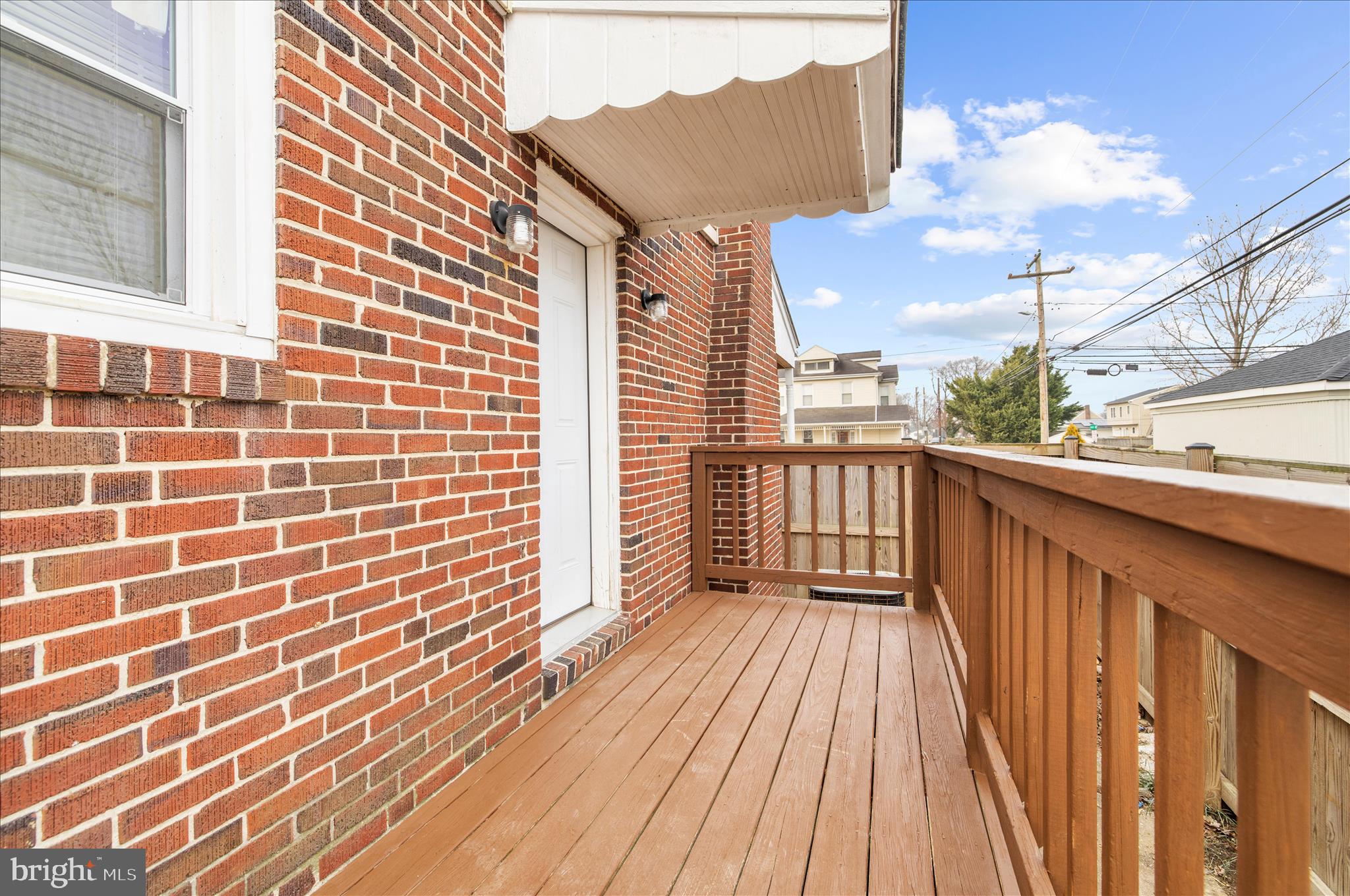 5701 Magie Street Baltimore, MD 21225 - Photo 42 of 49 a view of a balcony with wooden floor