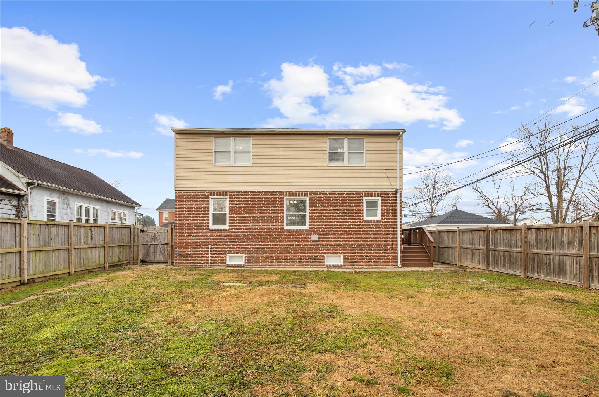 5701 Magie Street Baltimore, MD 21225 - Photo 43 of 49 a front view of a house with a yard and garage