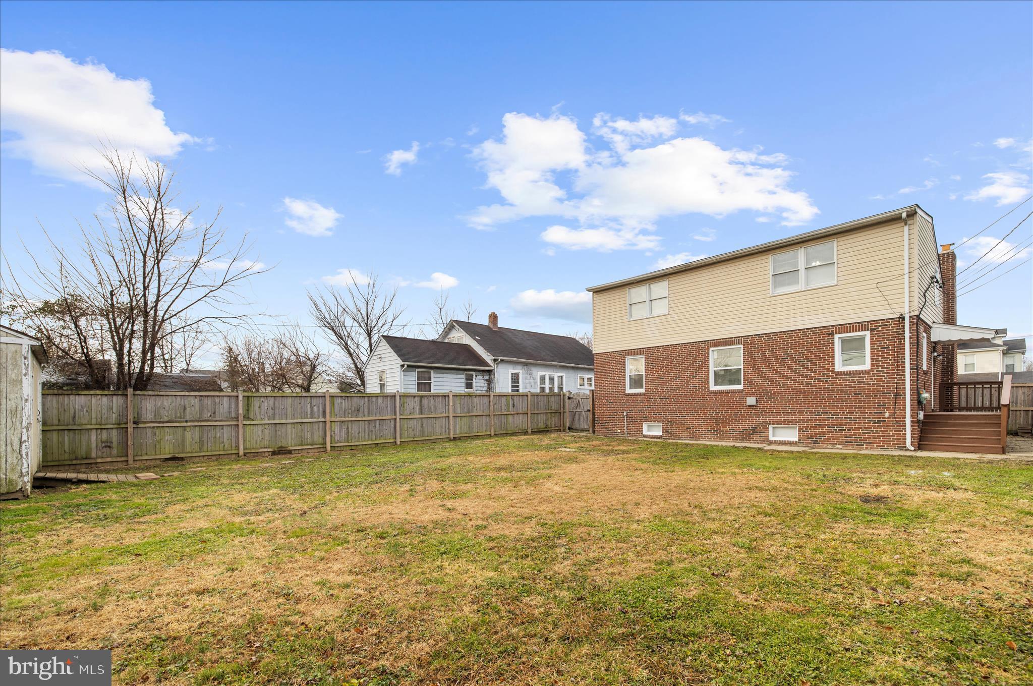 5701 Magie Street Baltimore, MD 21225 - Photo 44 of 49 a view of a house with a yard