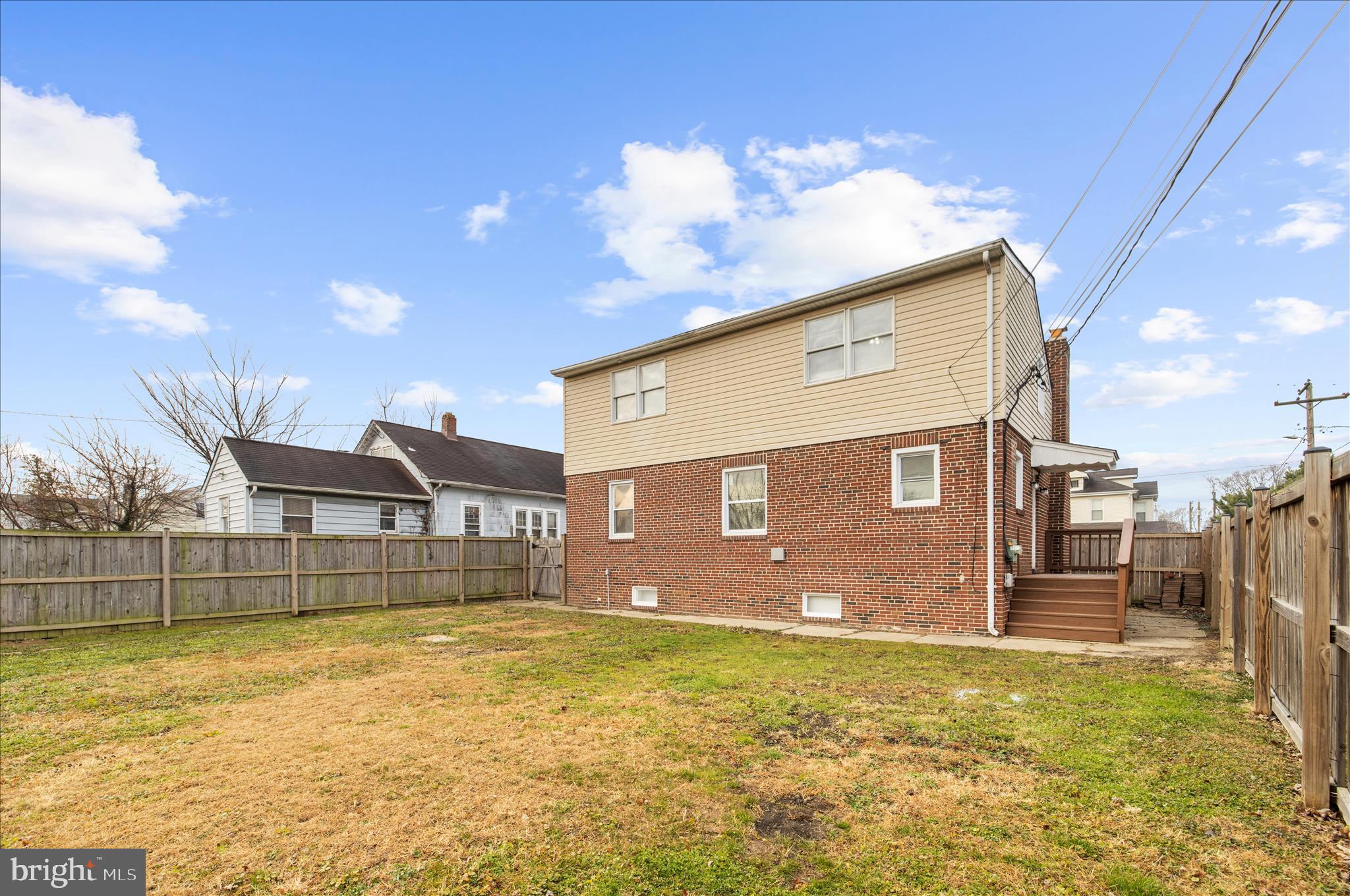 5701 Magie Street Baltimore, MD 21225 - Photo 47 of 49 a front view of a house with a swimming pool