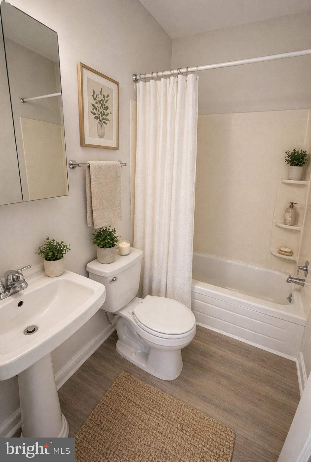 5608-00 Ridge Avenue, Unit F4 Philadelphia, PA 19128 - Photo 5 of 5 a bathroom with a sink toilet and shower