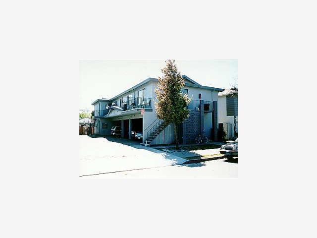 3580 Rolison Road Redwood City, CA 94063 - Photo 1 of 1 a tall building with a large tree in front of it