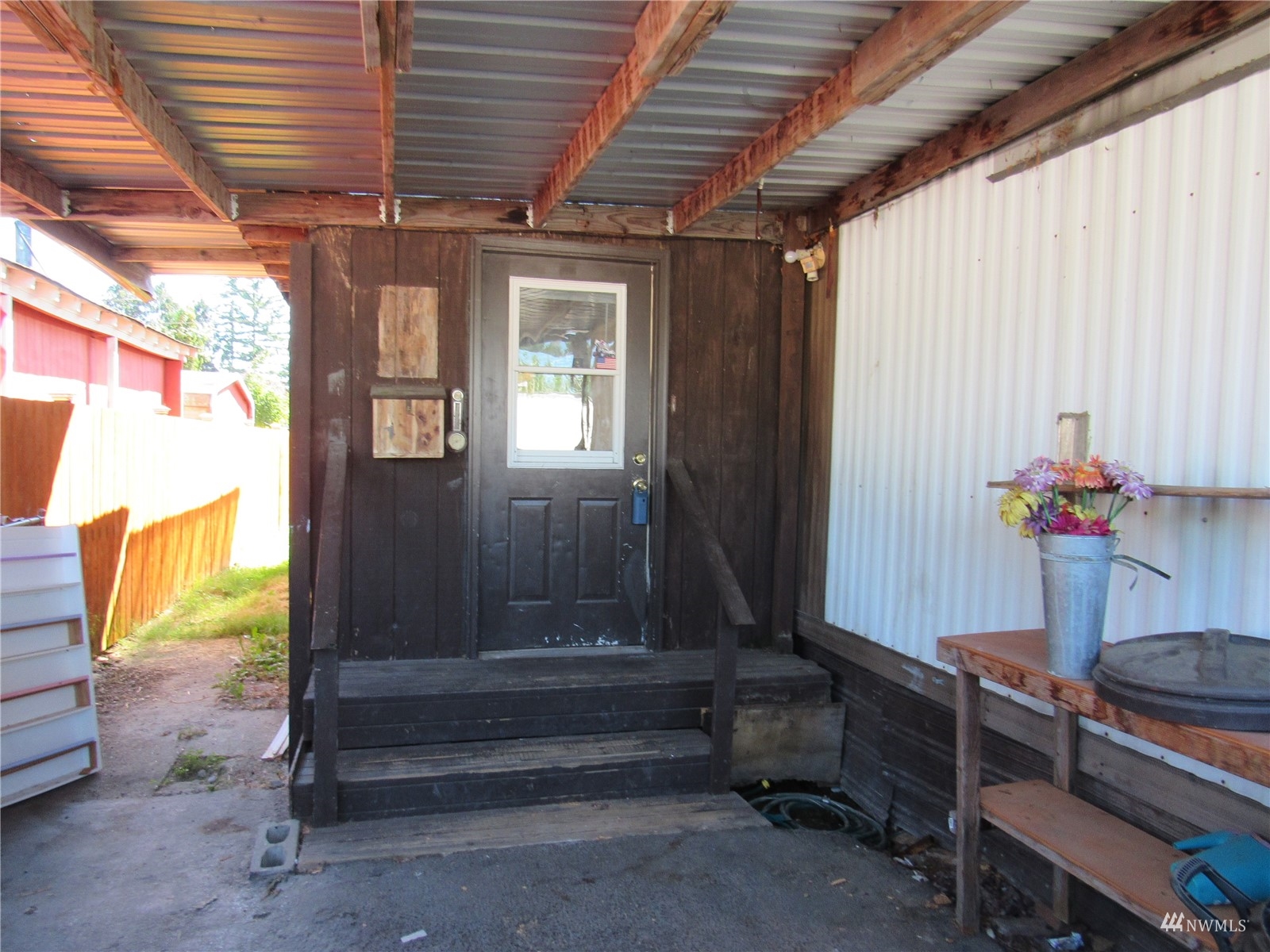 1121 Curtis Street, Unit 18 Sedro-Woolley, WA 98284 - Photo 1 of 20 a view of patio with furniture and a window