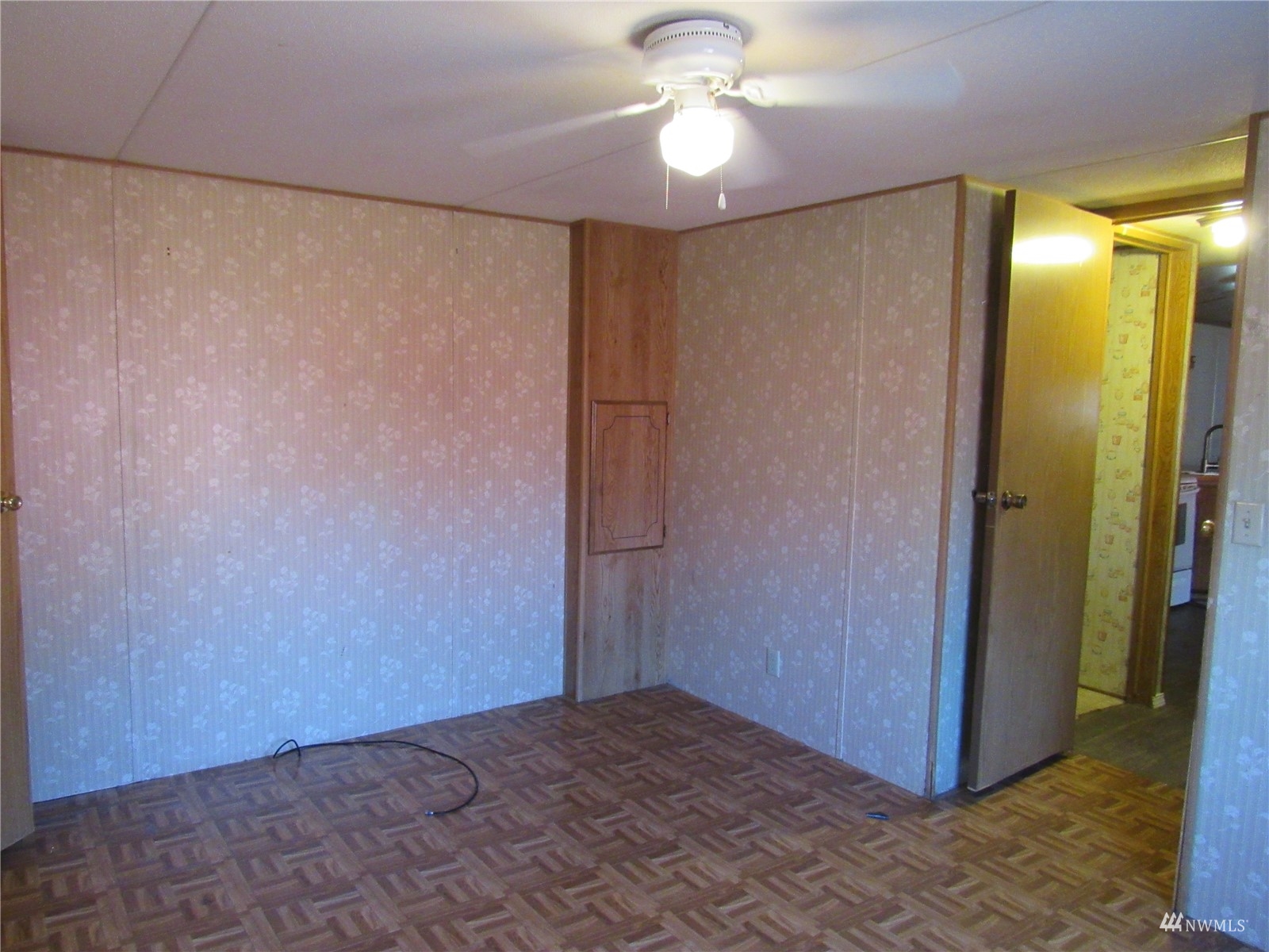 1121 Curtis Street, Unit 18 Sedro-Woolley, WA 98284 - Photo 11 of 20 a view of a room with a chandelier fan and closet area