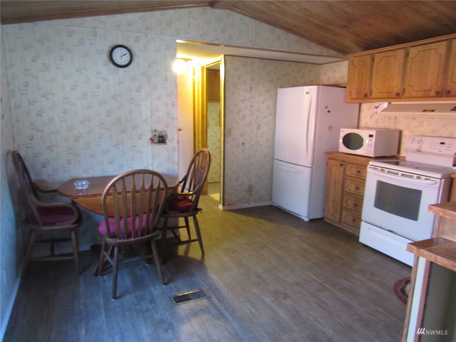 1121 Curtis Street, Unit 18 Sedro-Woolley, WA 98284 - Photo 10 of 20 a view of a dining room with furniture and wooden floor
