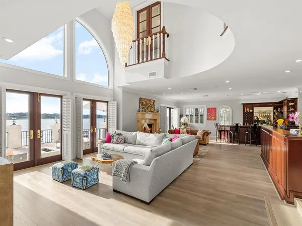 a view of a hallway with a livingroom and entryway
