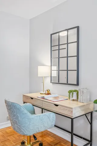 a workspace with furniture and window