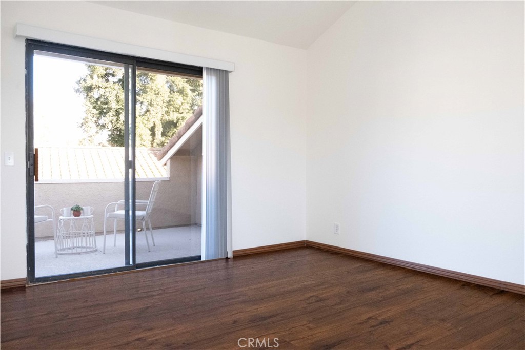 1739 Compromise Line Road Glendora, CA 91740 - Photo 14 of 29 an empty room with wooden floor and windows