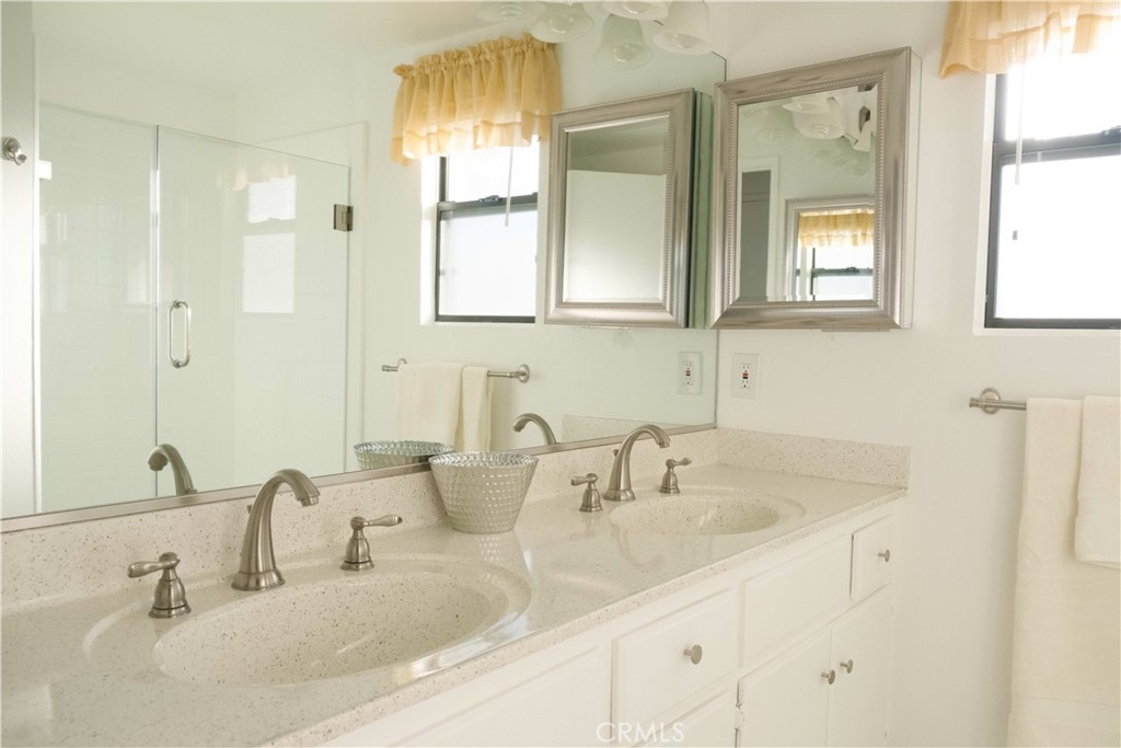 1739 Compromise Line Road Glendora, CA 91740 - Photo 18 of 29 a bathroom with double vanity sinks and a mirror