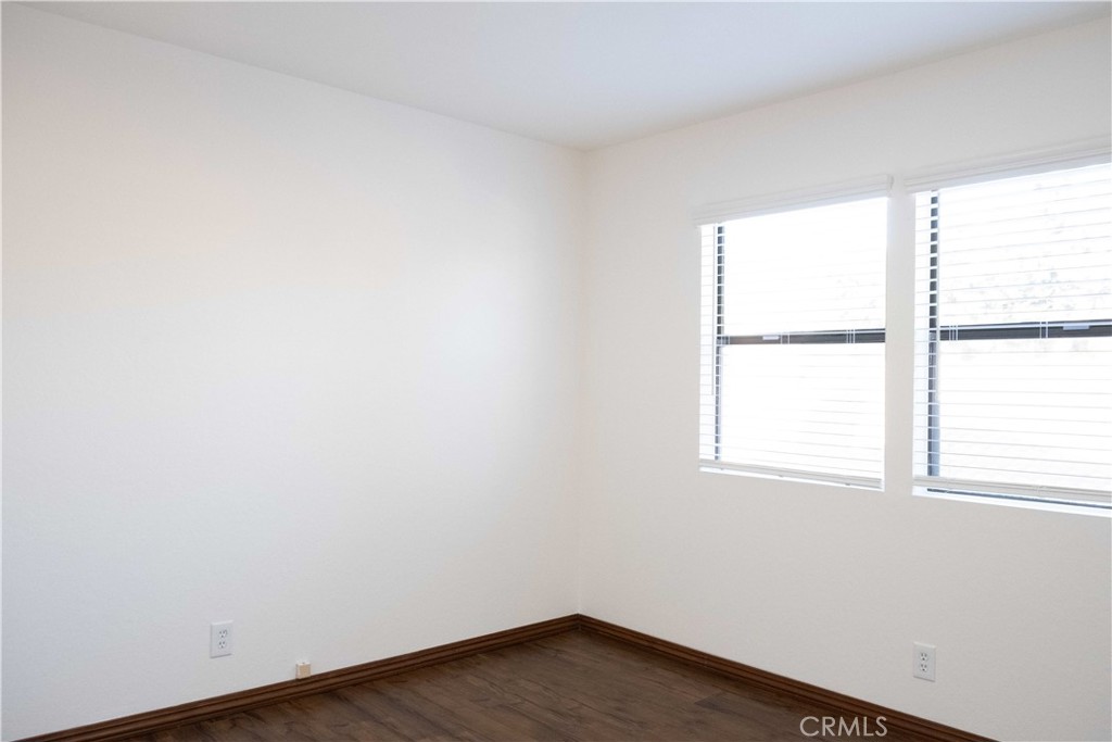 1739 Compromise Line Road Glendora, CA 91740 - Photo 20 of 29 an empty room with wooden floor and windows