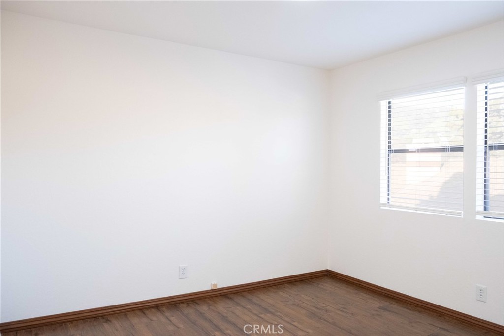 1739 Compromise Line Road Glendora, CA 91740 - Photo 23 of 29 an empty room with wooden floor and windows