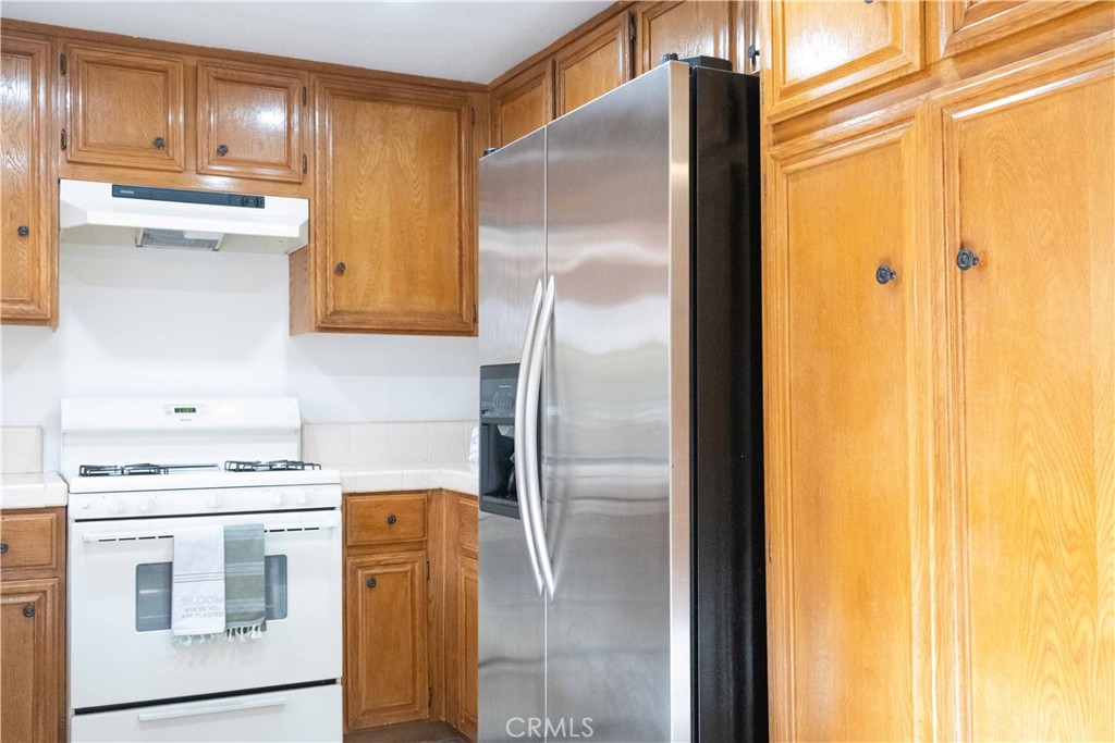 1739 Compromise Line Road Glendora, CA 91740 - Photo 9 of 29 a kitchen with stainless steel appliances granite countertop a refrigerator and a stove