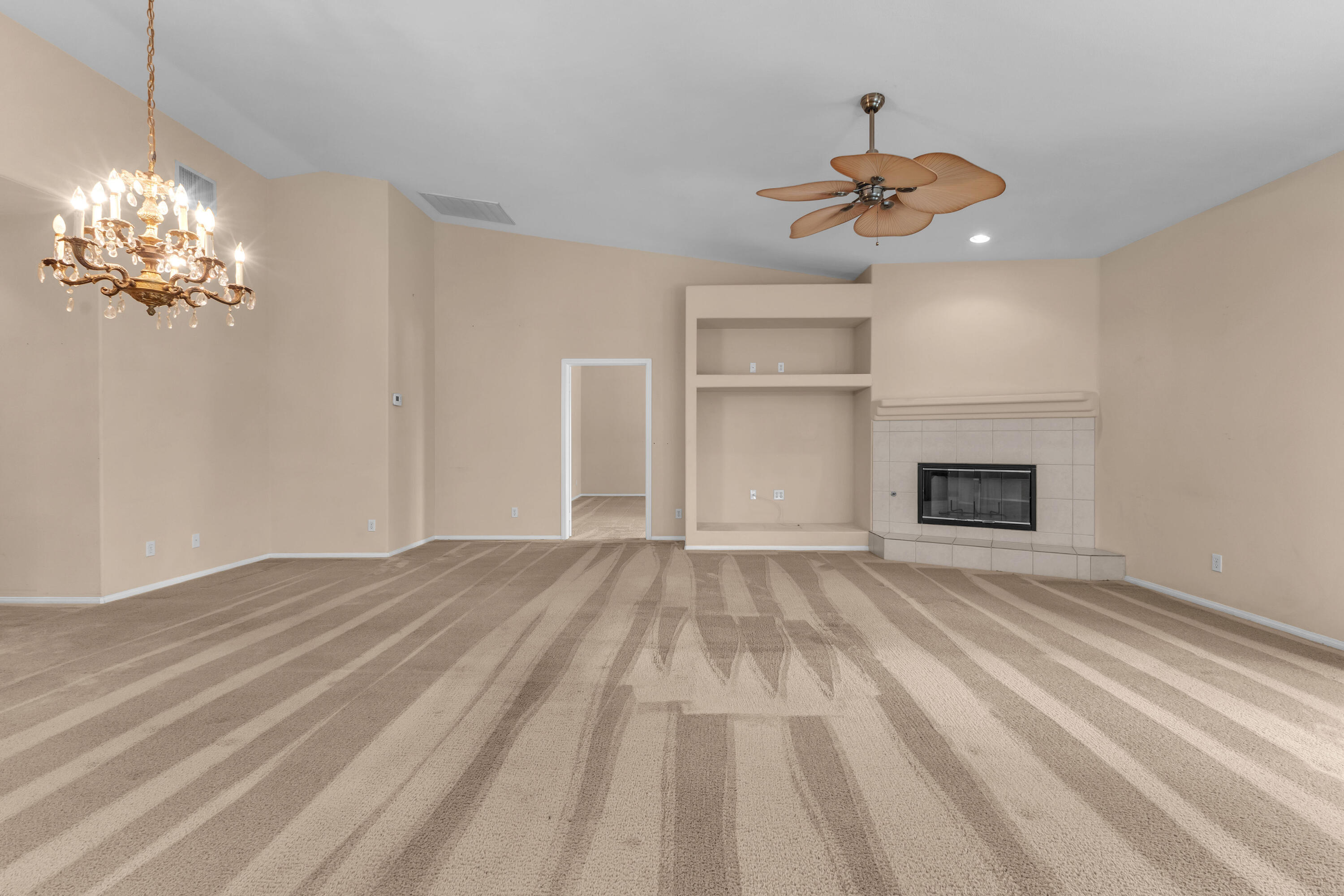 48690 Hepburn Drive Indio, CA 92201 - Photo 13 of 36 a view of empty room with wooden floor and fan