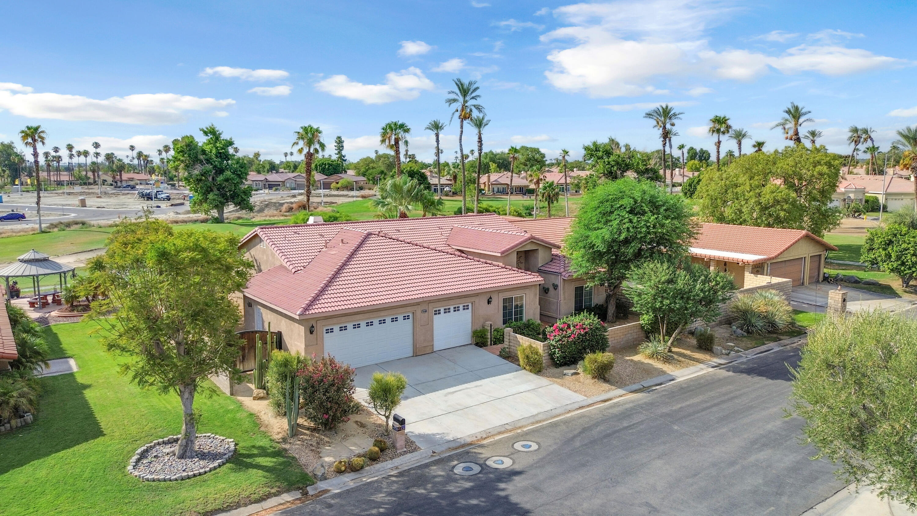 48690 Hepburn Drive Indio, CA 92201 - Photo 2 of 36 a view of a house with garden and a sitting area