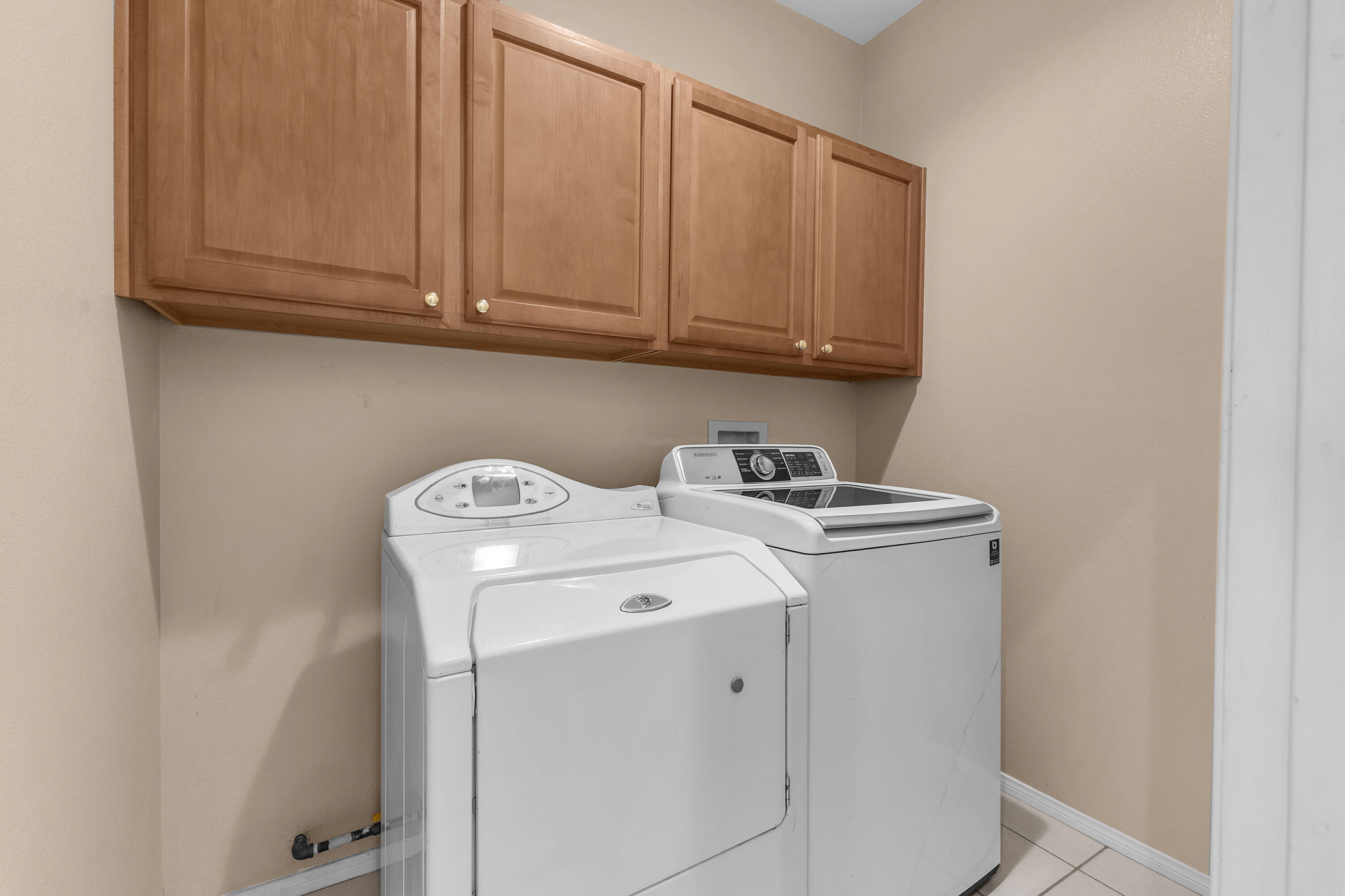 48690 Hepburn Drive Indio, CA 92201 - Photo 21 of 36 a utility room with dryer and washer