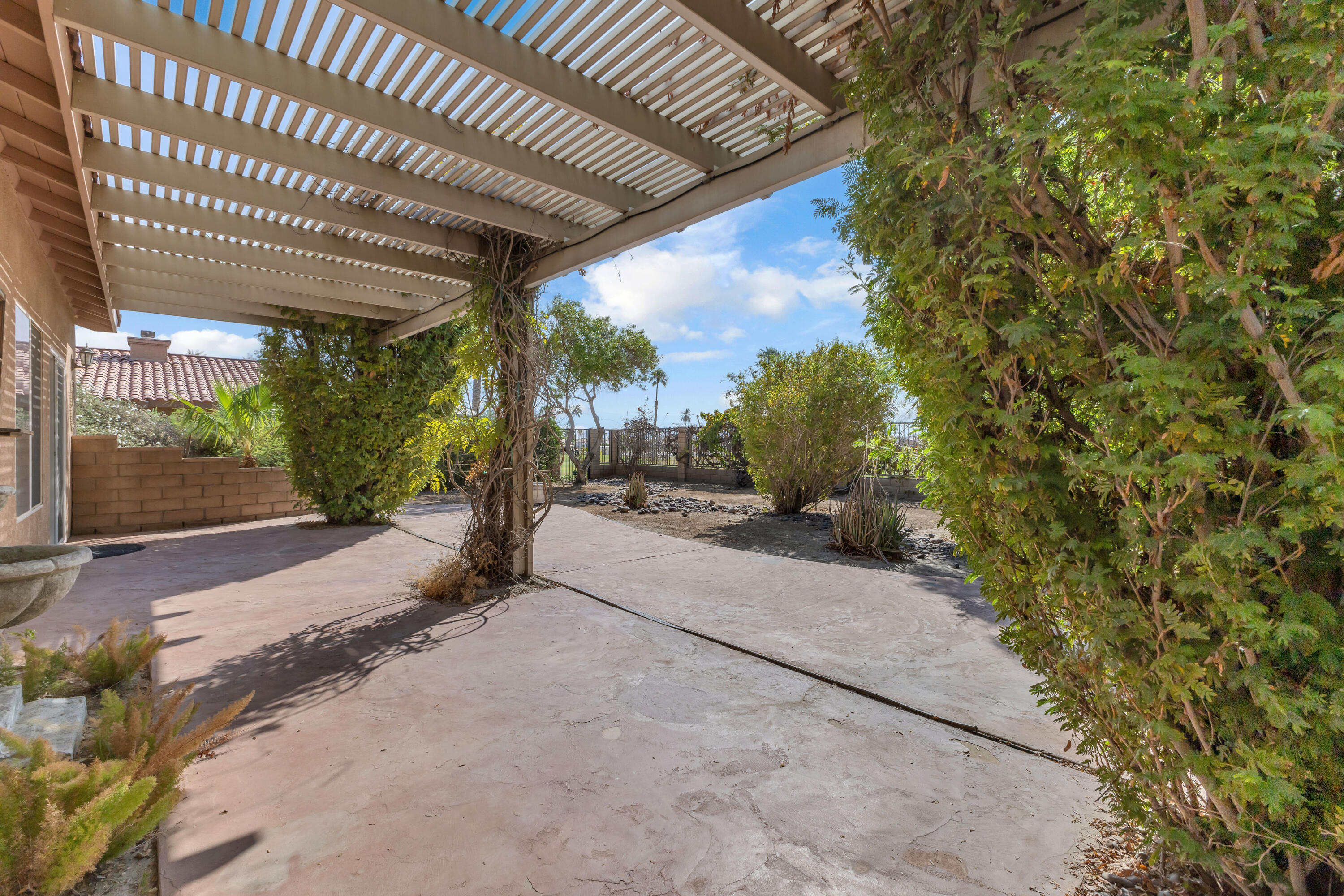 48690 Hepburn Drive Indio, CA 92201 - Photo 25 of 36 a path view of a house with basket ball court