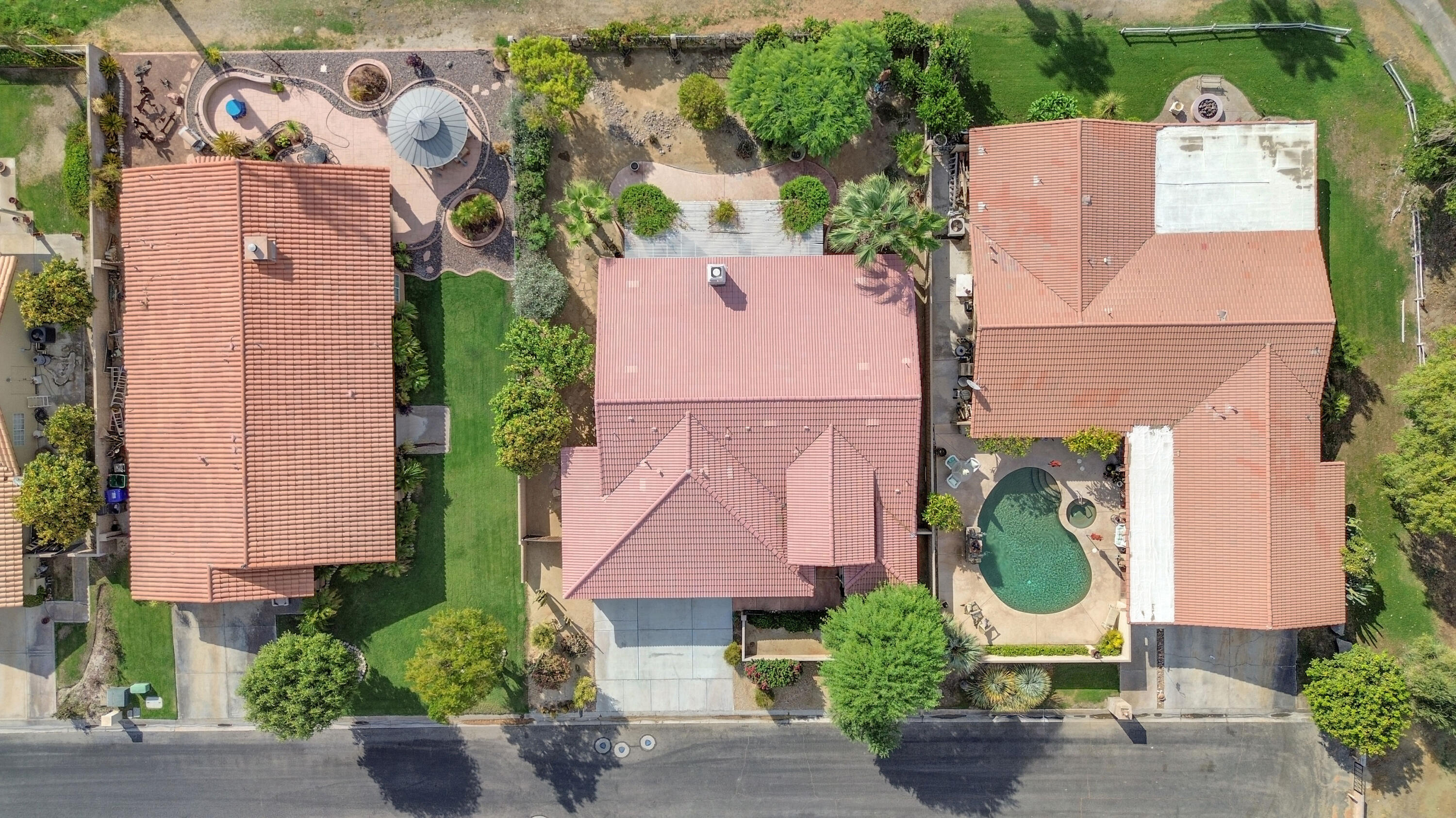 48690 Hepburn Drive Indio, CA 92201 - Photo 34 of 36 an aerial view of a house with a garden and a yard