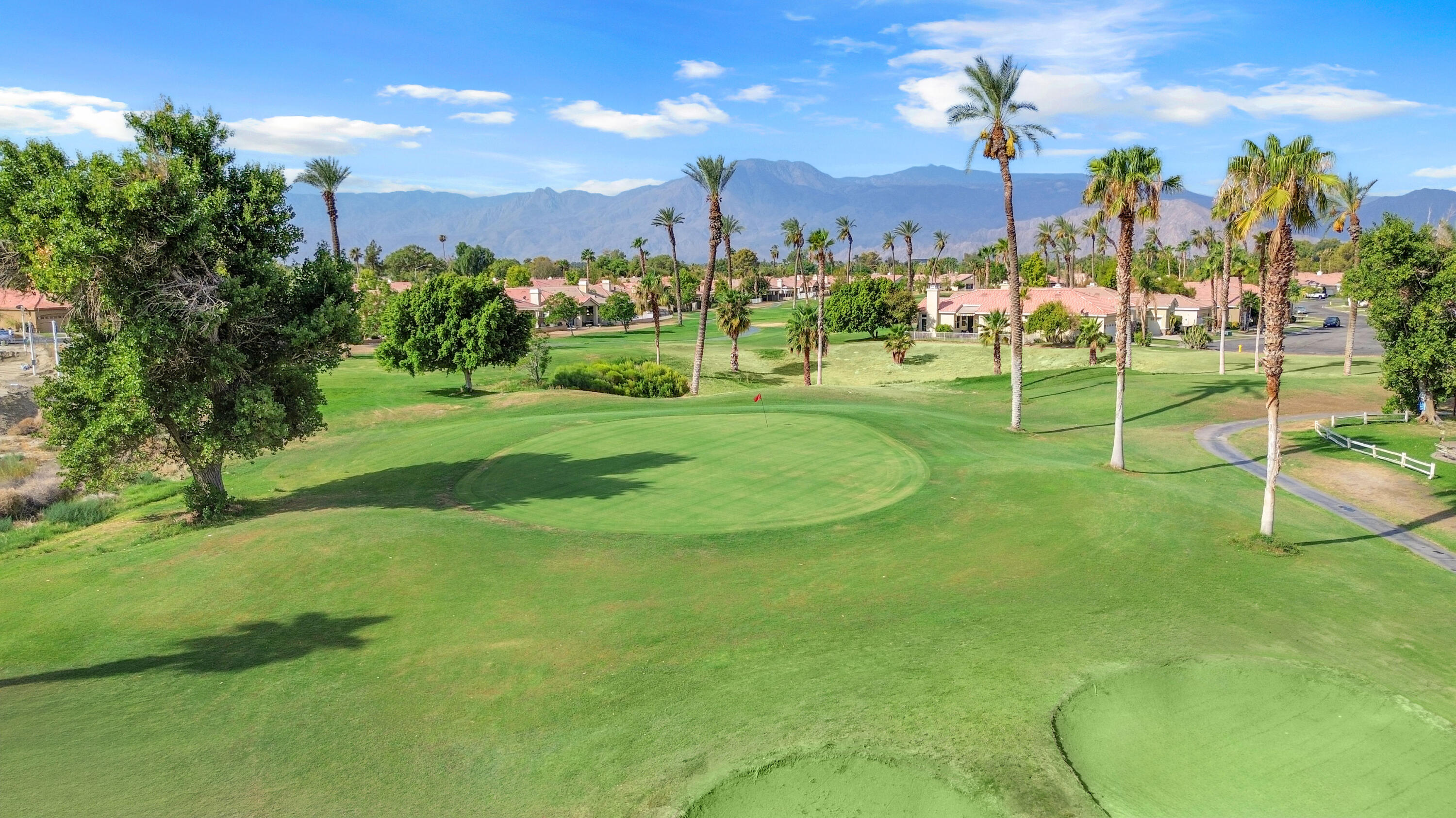 48690 Hepburn Drive Indio, CA 92201 - Photo 36 of 36 a view of a big yard with a fountain and a big yard