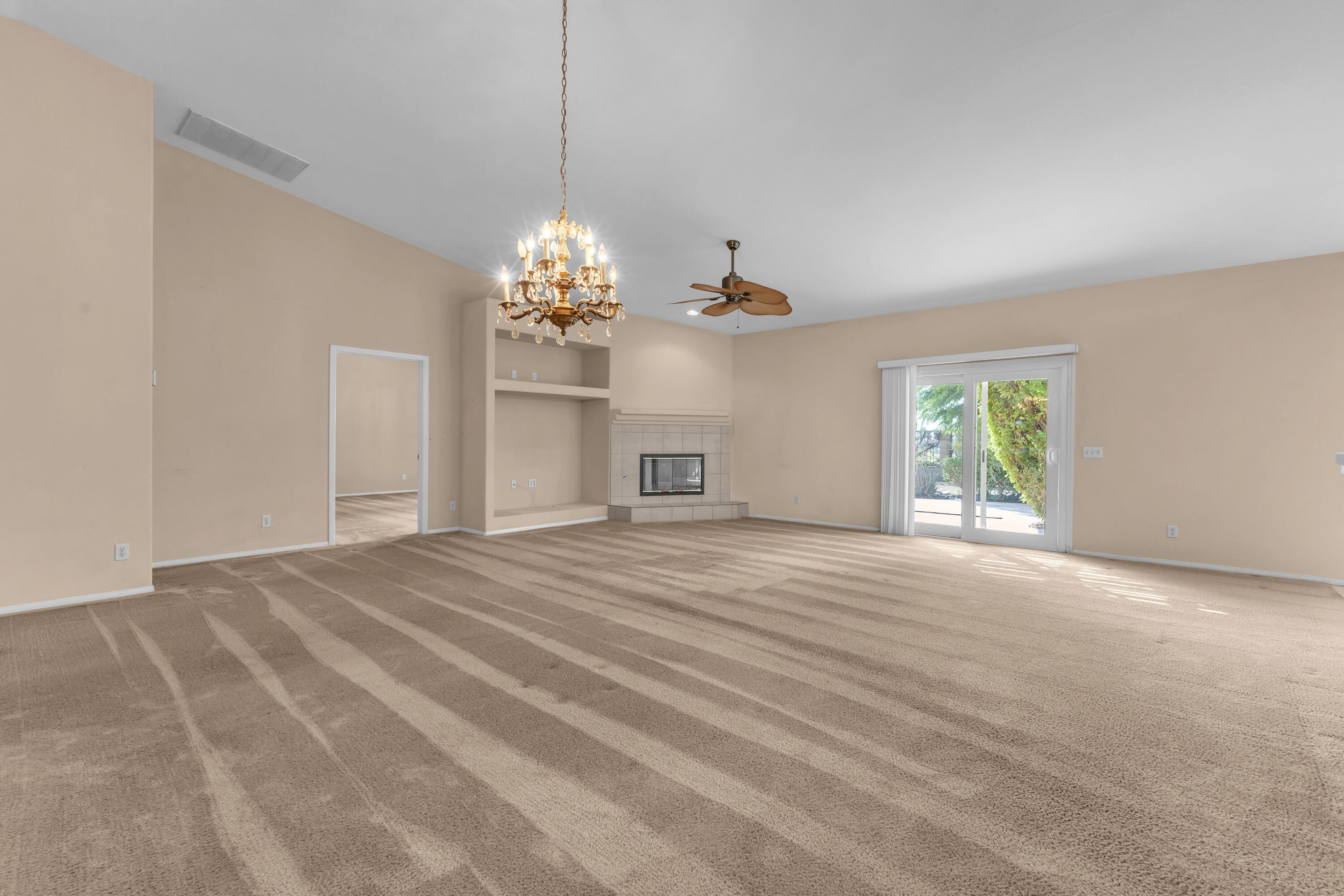 48690 Hepburn Drive Indio, CA 92201 - Photo 8 of 36 a view of a chandelier in a room with chandelier and window