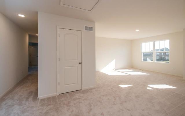 4331 Little Leaf Road Naperville, IL 60564 - Photo 23 of 39 an empty room with windows and closet