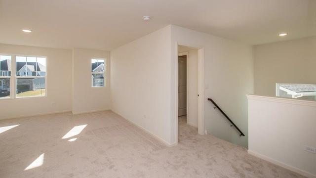 4331 Little Leaf Road Naperville, IL 60564 - Photo 24 of 39 an empty room with windows and entrance