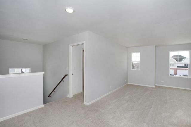 4331 Little Leaf Road Naperville, IL 60564 - Photo 25 of 39 a view of an empty room with a window