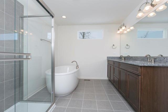 4331 Little Leaf Road Naperville, IL 60564 - Photo 27 of 39 a bathroom with a granite countertop sink a toilet and shower