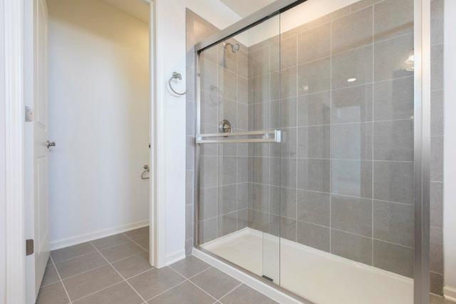 4331 Little Leaf Road Naperville, IL 60564 - Photo 28 of 39 a bathroom with a glass shower door
