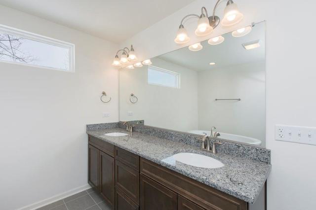 4331 Little Leaf Road Naperville, IL 60564 - Photo 29 of 39 a bathroom with a granite countertop double vanity and a mirror