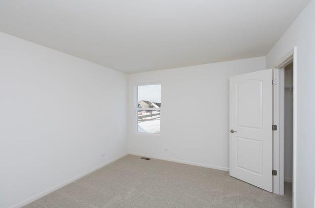 4331 Little Leaf Road Naperville, IL 60564 - Photo 30 of 39 an empty room with windows