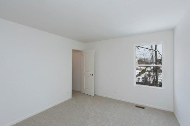 4331 Little Leaf Road Naperville, IL 60564 - Photo 31 of 39 an empty room with windows