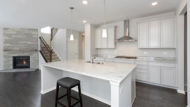 4331 Little Leaf Road Naperville, IL 60564 - Photo 6 of 39 a kitchen with a sink cabinets and wooden floor