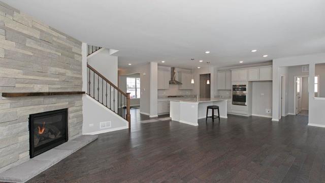4331 Little Leaf Road Naperville, IL 60564 - Photo 8 of 39 a view of kitchen with livingroom and wooden floor