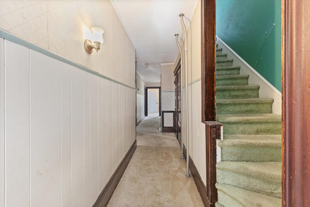 98 Webster Street Haverhill, MA 01830 - Photo 32 of 42 a view of a hallway with staircase